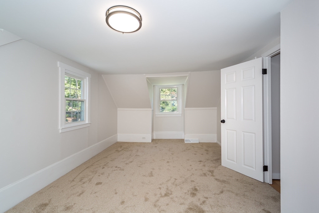6 MacArthur Road Natick, MA 01760 - Photo 22 of 31 an empty room with windows and closet