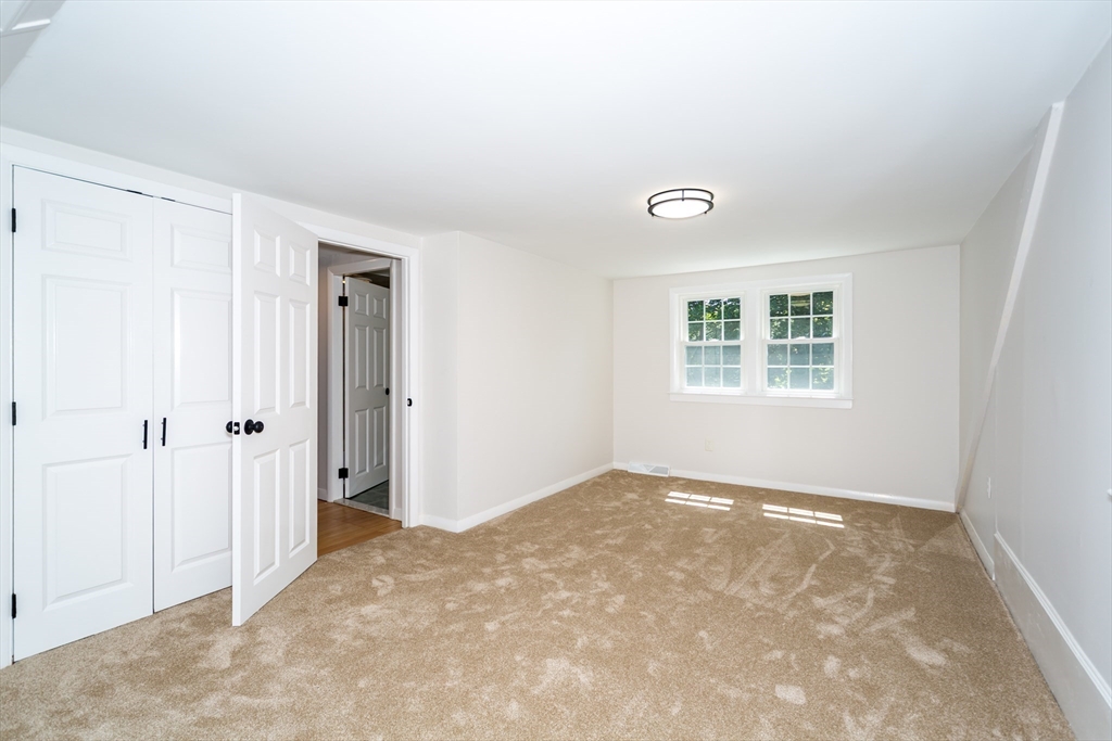 6 MacArthur Road Natick, MA 01760 - Photo 23 of 31 a view of an empty room with a window