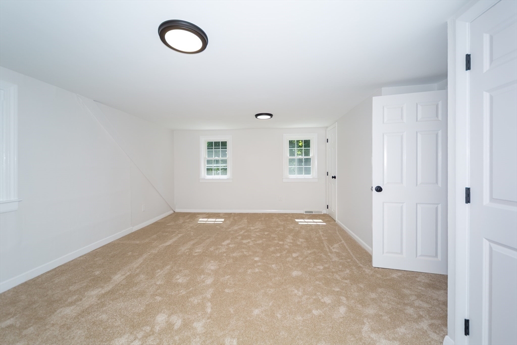 6 MacArthur Road Natick, MA 01760 - Photo 26 of 31 an empty room with a fan & a window