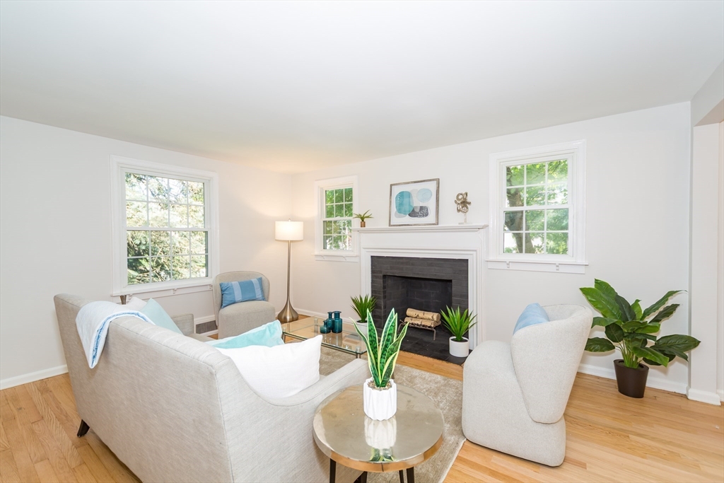 6 MacArthur Road Natick, MA 01760 - Photo 4 of 31 a living room with furniture a potted plant and a fireplace