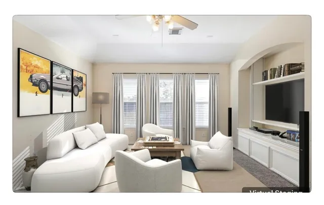 a living room with furniture and a flat screen tv