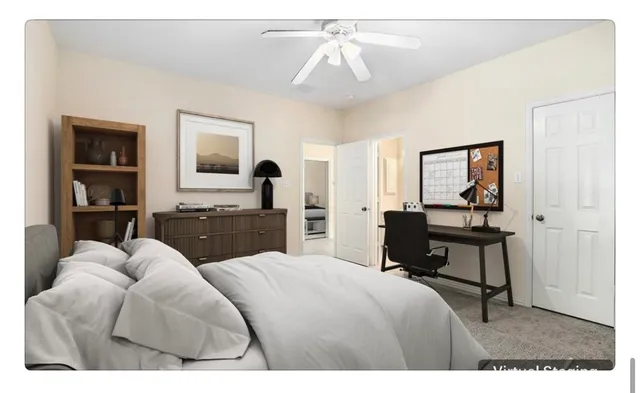 a bedroom with a bed window and furniture