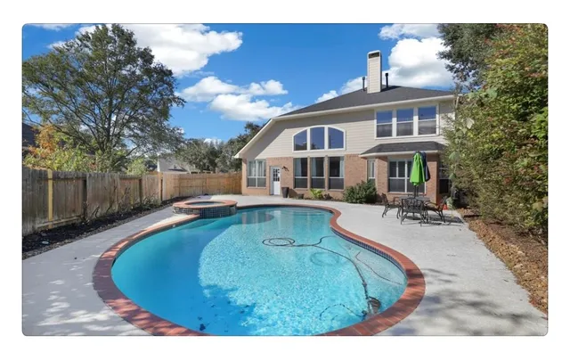 a view of a house with swimming pool