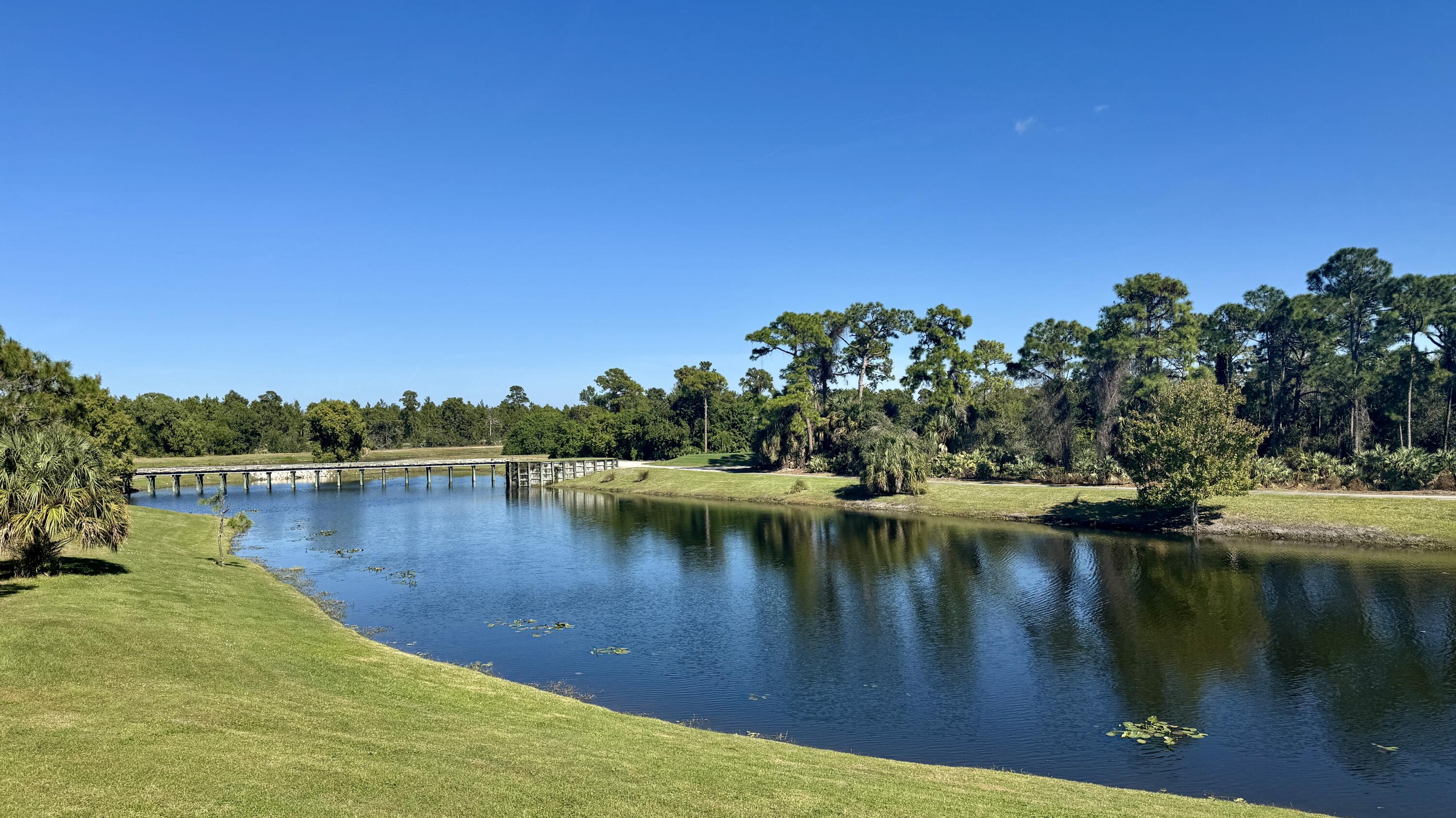 158 Southeast Rio Angelica Port St. Lucie, FL 34984 - Photo 4 of 12 a view of a lake with houses in the back
