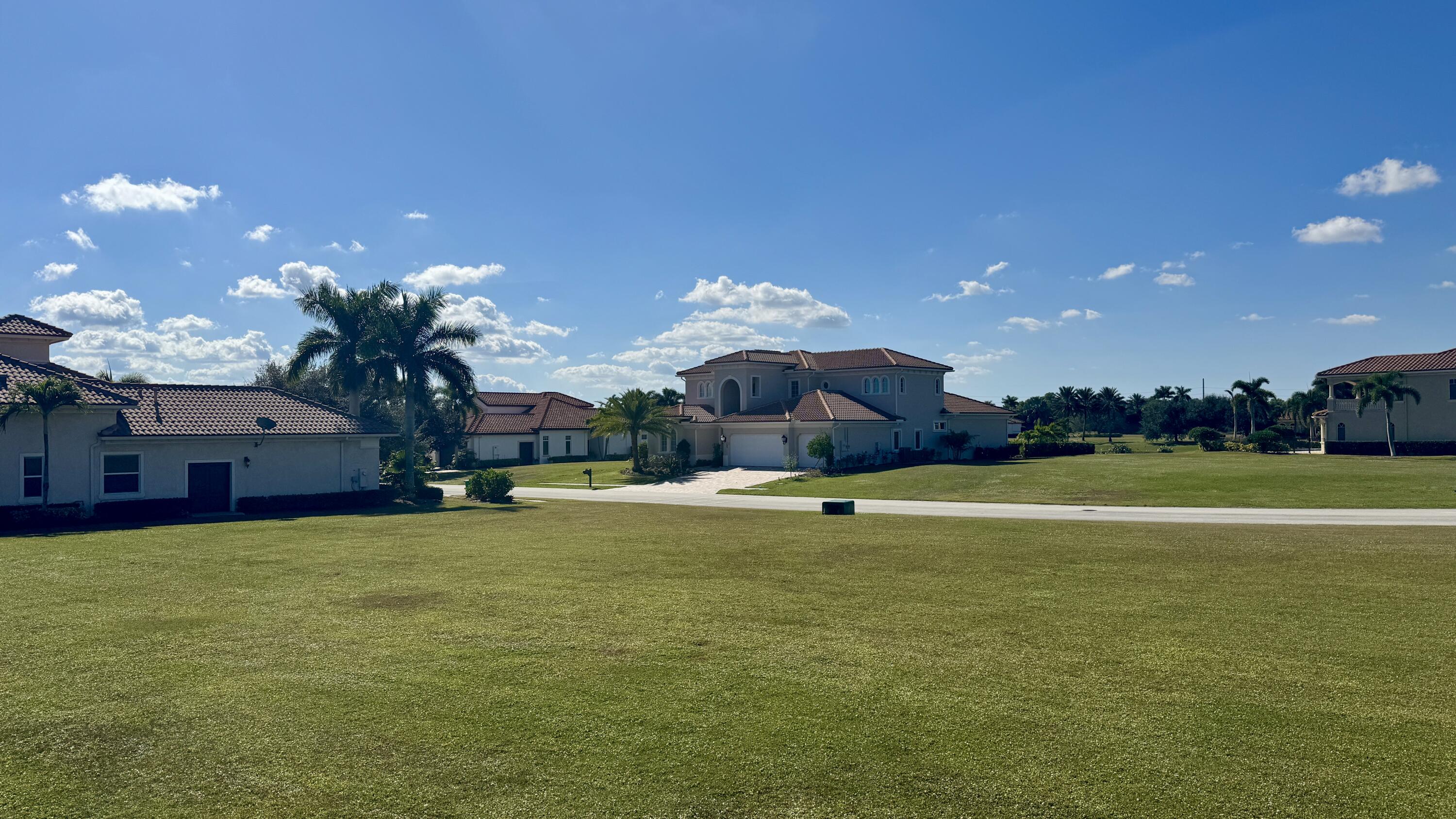 158 Southeast Rio Angelica Port St. Lucie, FL 34984 - Photo 5 of 12 a view of a house with a swimming pool and a yard