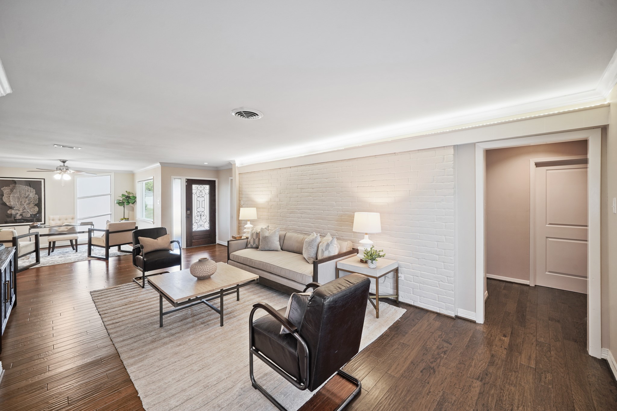5671 Sylmar Road Houston, TX 77081 - Photo 44 of 50 a living room with furniture and wooden floor