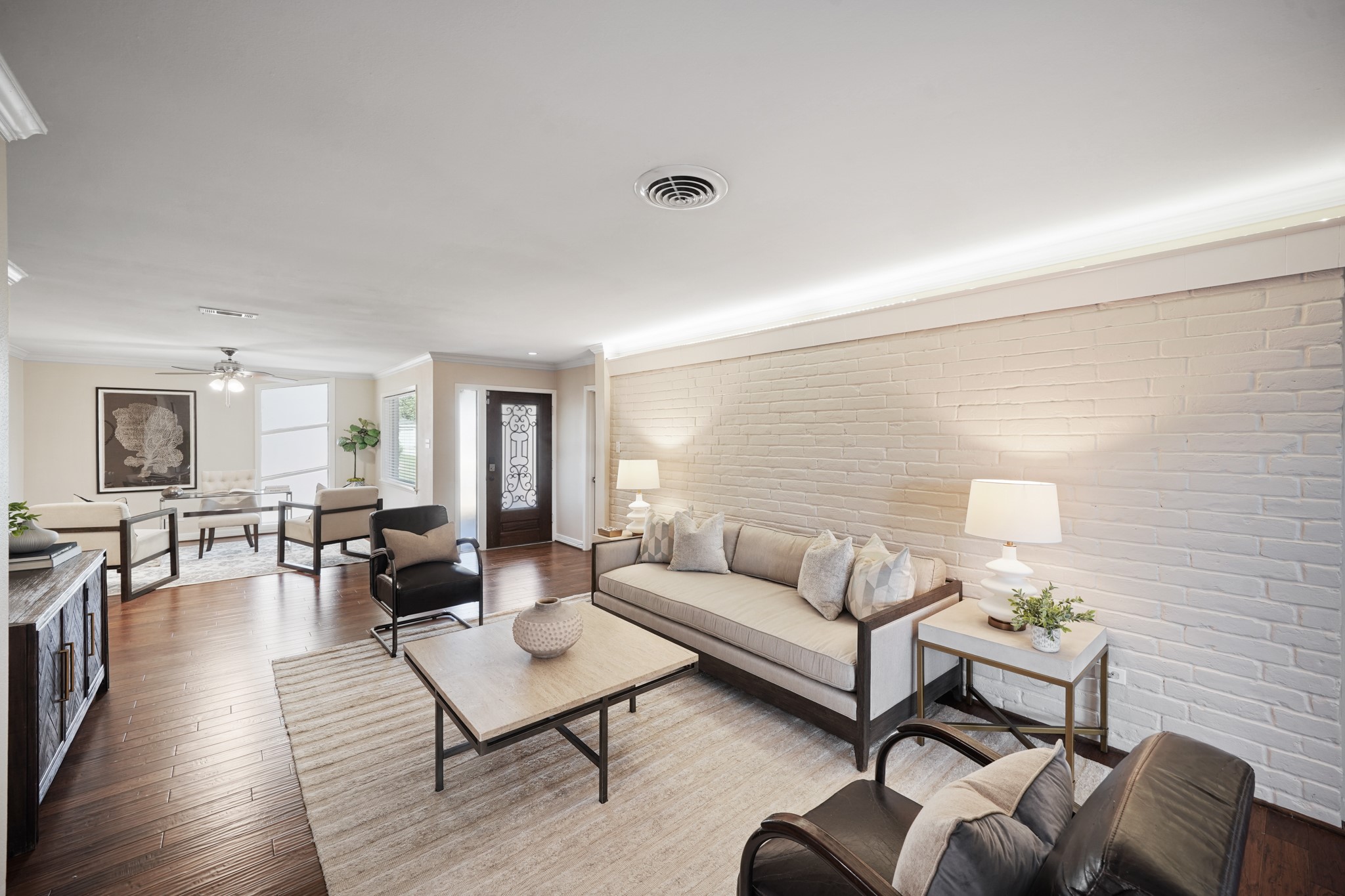 5671 Sylmar Road Houston, TX 77081 - Photo 45 of 50 a living room with furniture rug and wooden floor