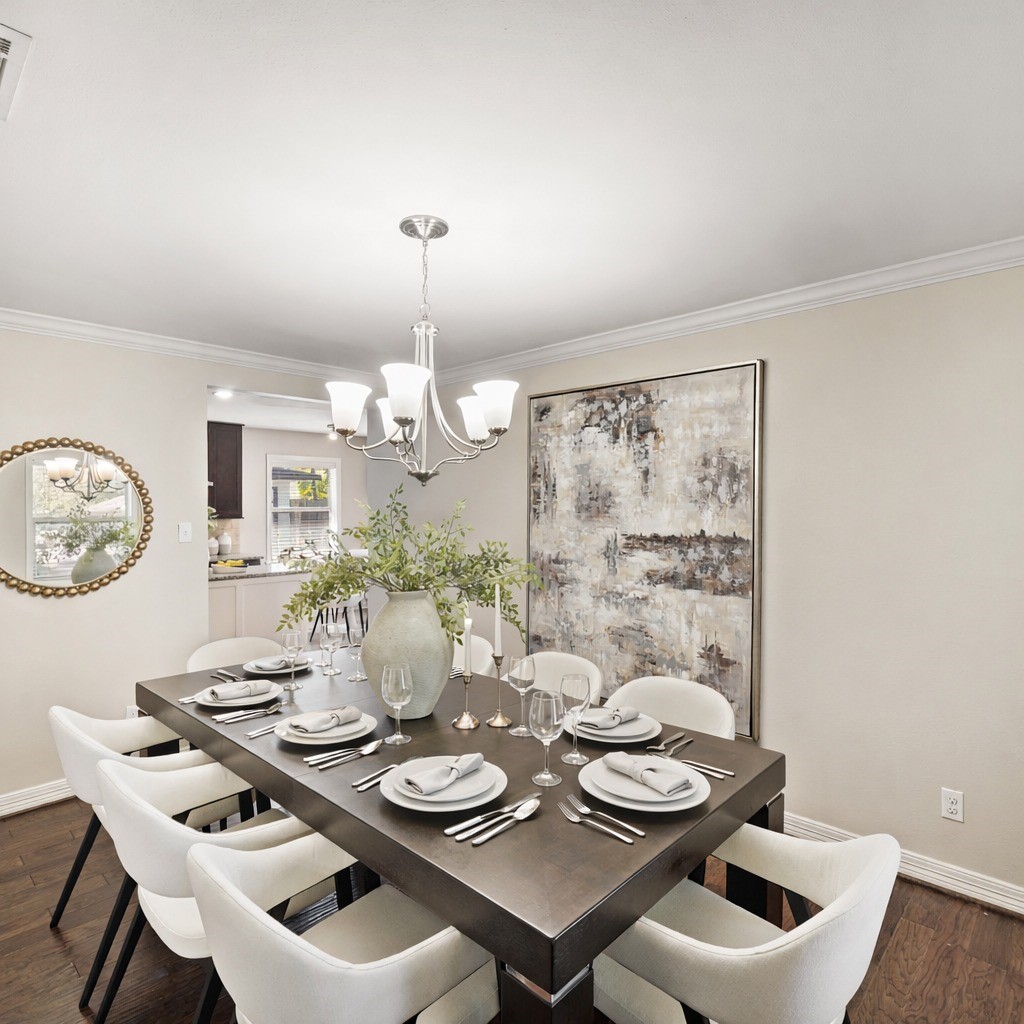 5671 Sylmar Road Houston, TX 77081 - Photo 13 of 50 a view of a dining room with furniture and wooden floor