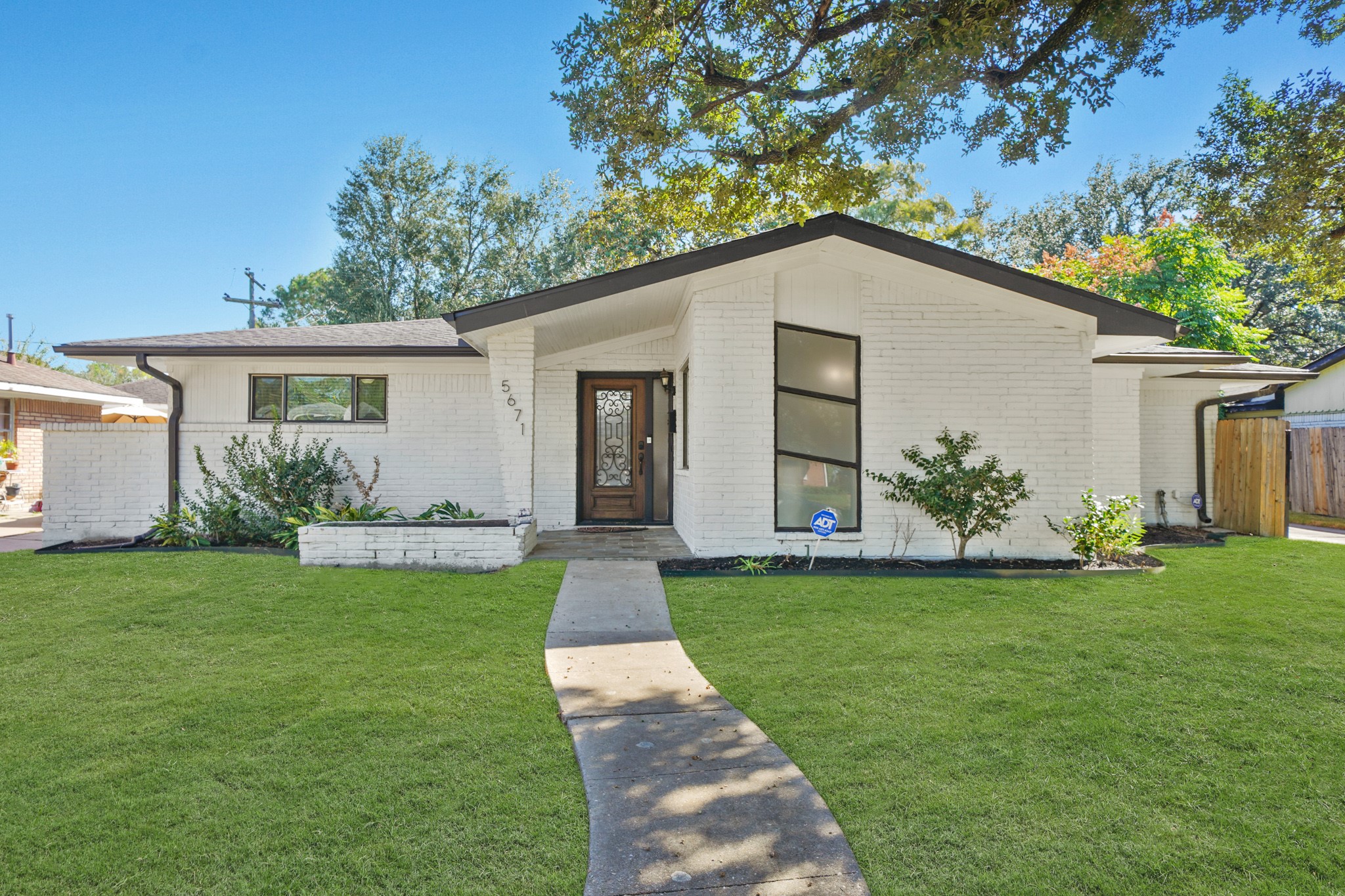 5671 Sylmar Road Houston, TX 77081 - Photo 2 of 50 a view of a house with a yard