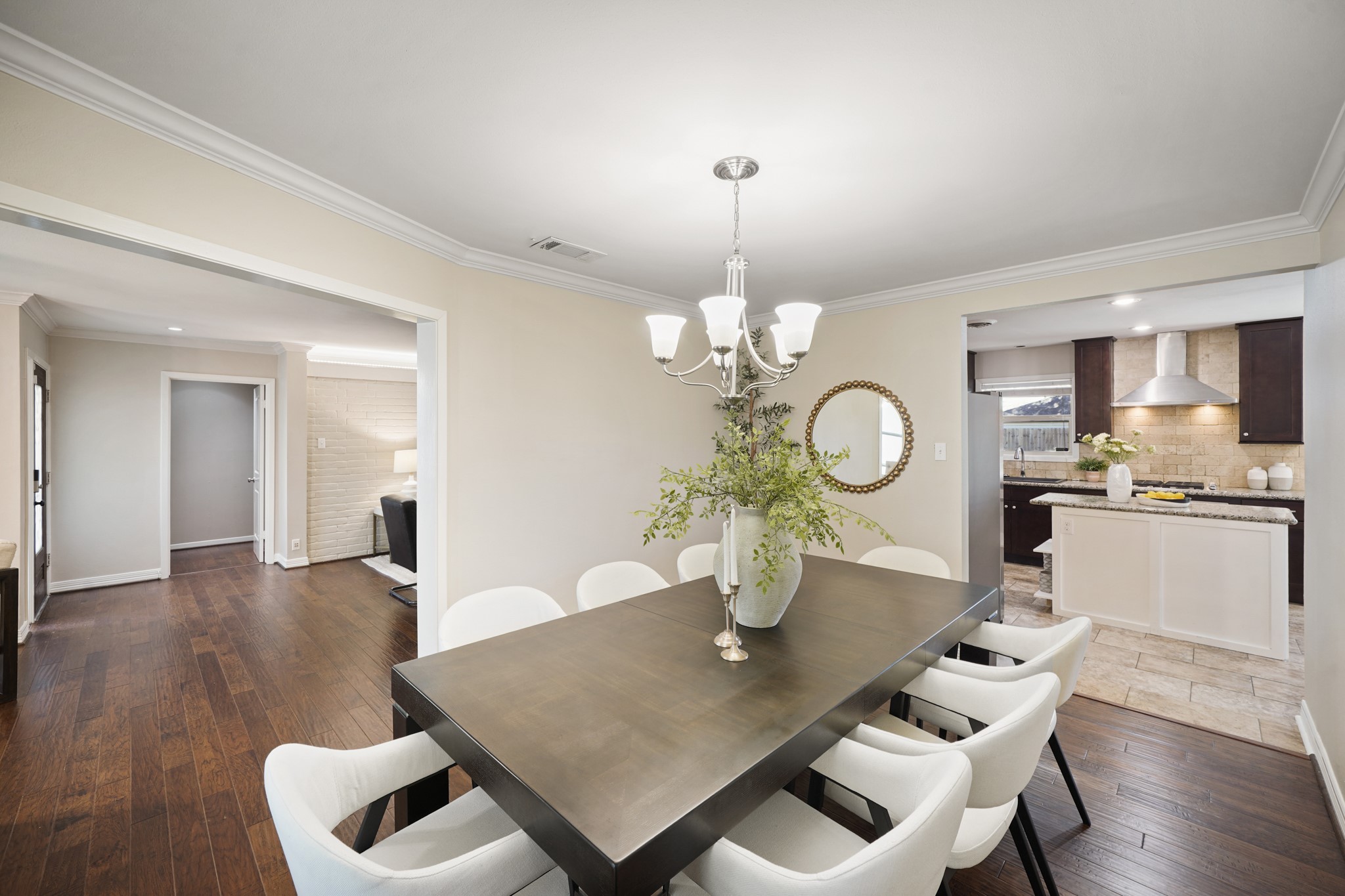 5671 Sylmar Road Houston, TX 77081 - Photo 49 of 50 a view of a dining room with furniture and wooden floor