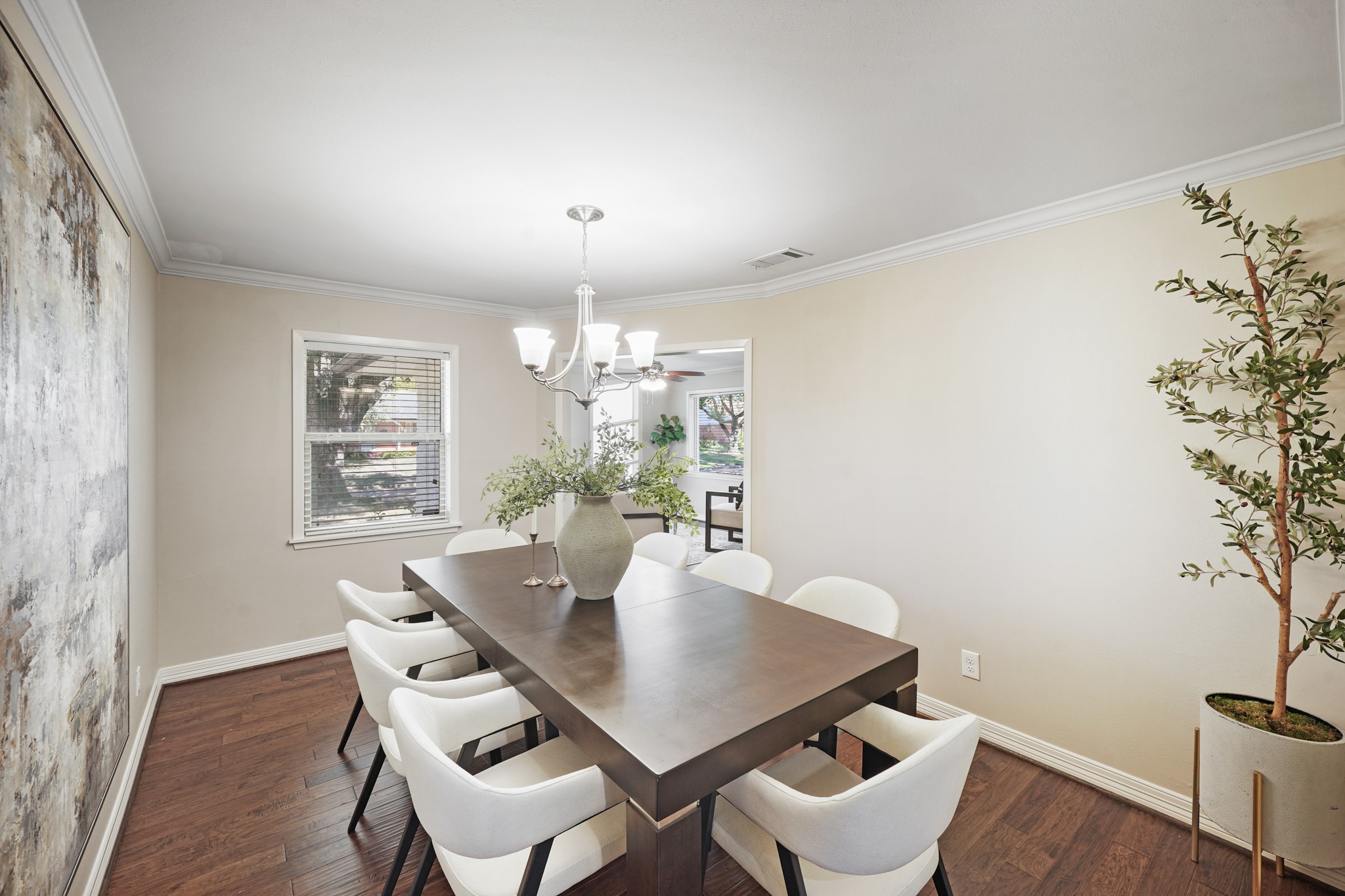 5671 Sylmar Road Houston, TX 77081 - Photo 14 of 50 a view of a dining room with furniture and wooden floor