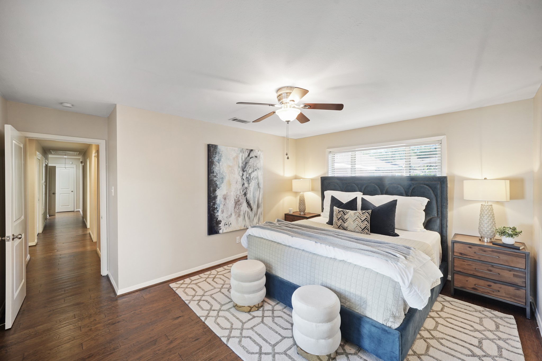 5671 Sylmar Road Houston, TX 77081 - Photo 23 of 50 a bedroom with a bed and a chandelier