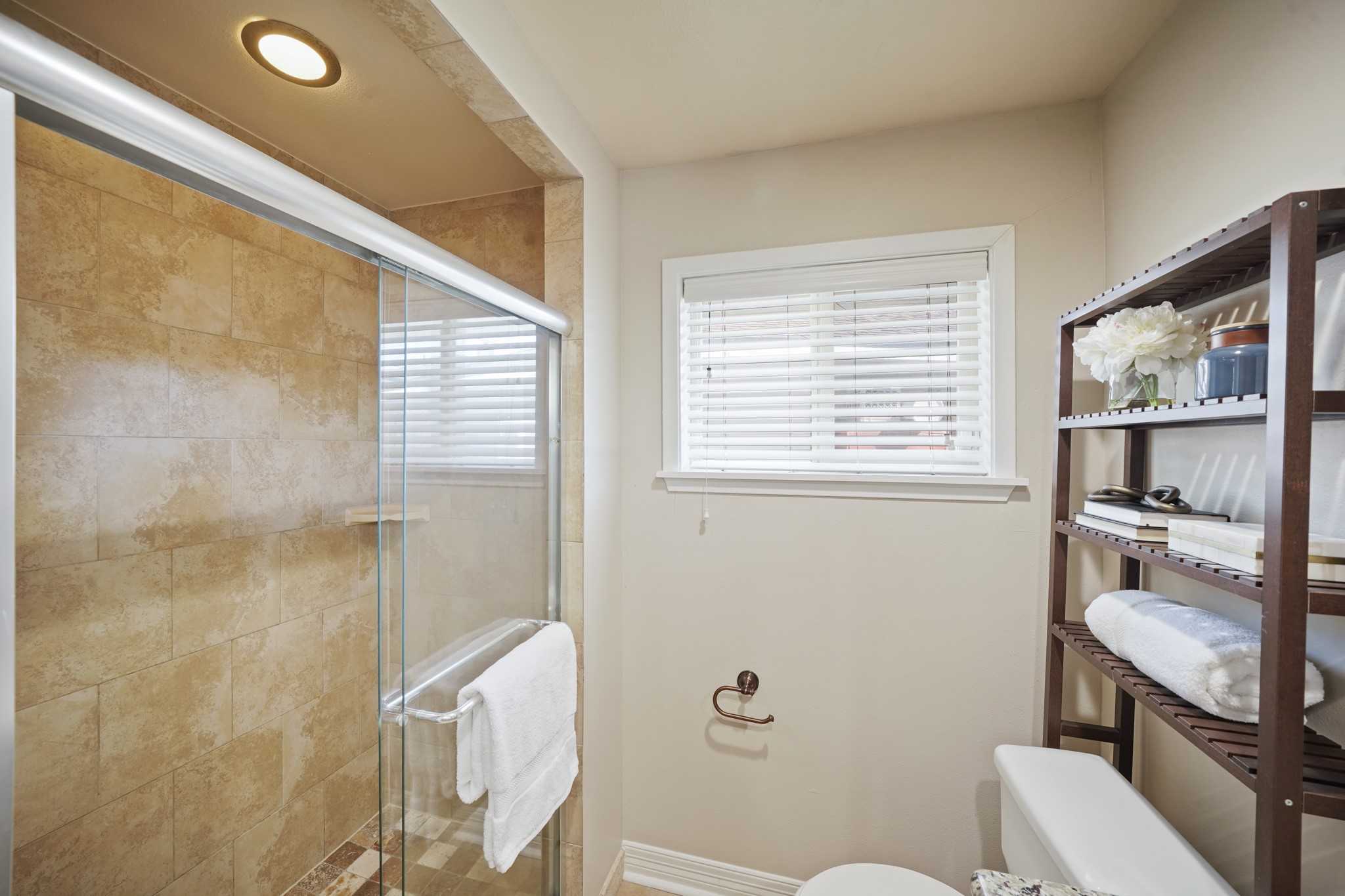 5671 Sylmar Road Houston, TX 77081 - Photo 26 of 50 a bathroom with a toilet a sink and a shower