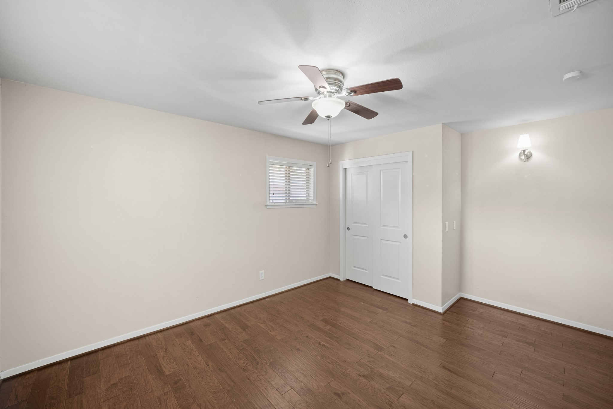 5671 Sylmar Road Houston, TX 77081 - Photo 33 of 50 a view of empty room with wooden floor