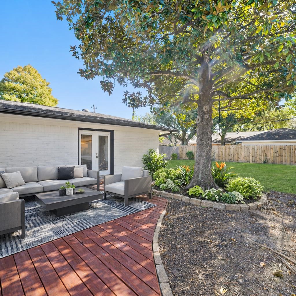 5671 Sylmar Road Houston, TX 77081 - Photo 37 of 50 a backyard of a house with table and chairs