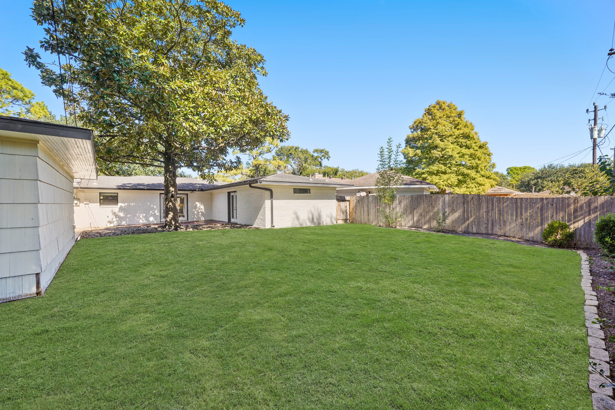 5671 Sylmar Road Houston, TX 77081 - Photo 40 of 50 a view of a house with a yard