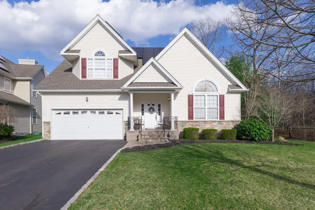 a front view of a house with garden