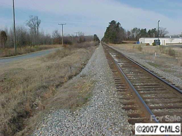 2210 Goldmine Road Monroe, NC 28110 - Photo 3 of 4 a view of a dry yard with wooden fence