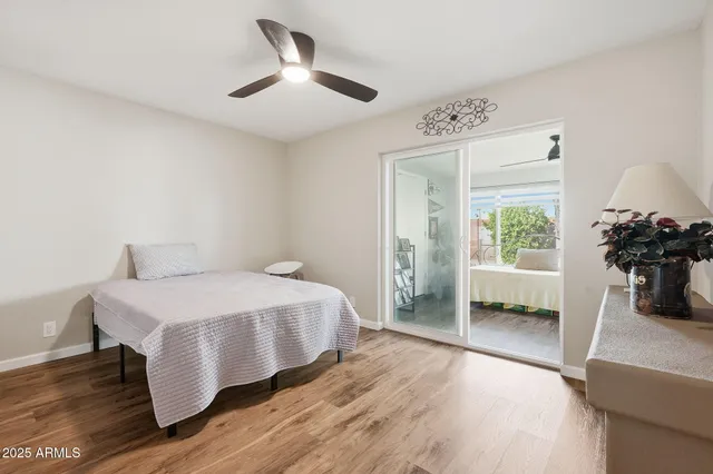 a bedroom with a bed and a couch