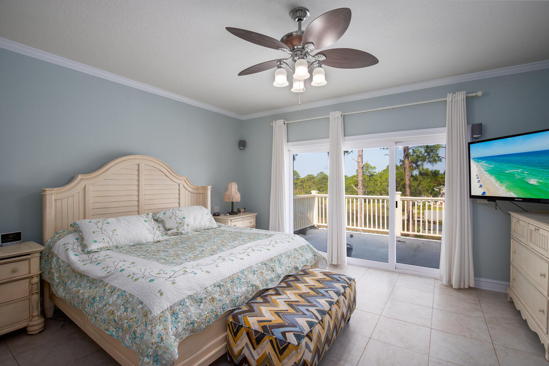 95 Blue Bell Circle Santa Rosa Beach, FL 32459 - Photo 19 of 29 a bedroom with a large bed and a large window
