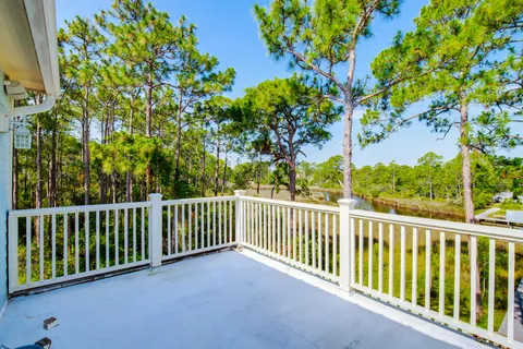 a view of a balcony with a tree