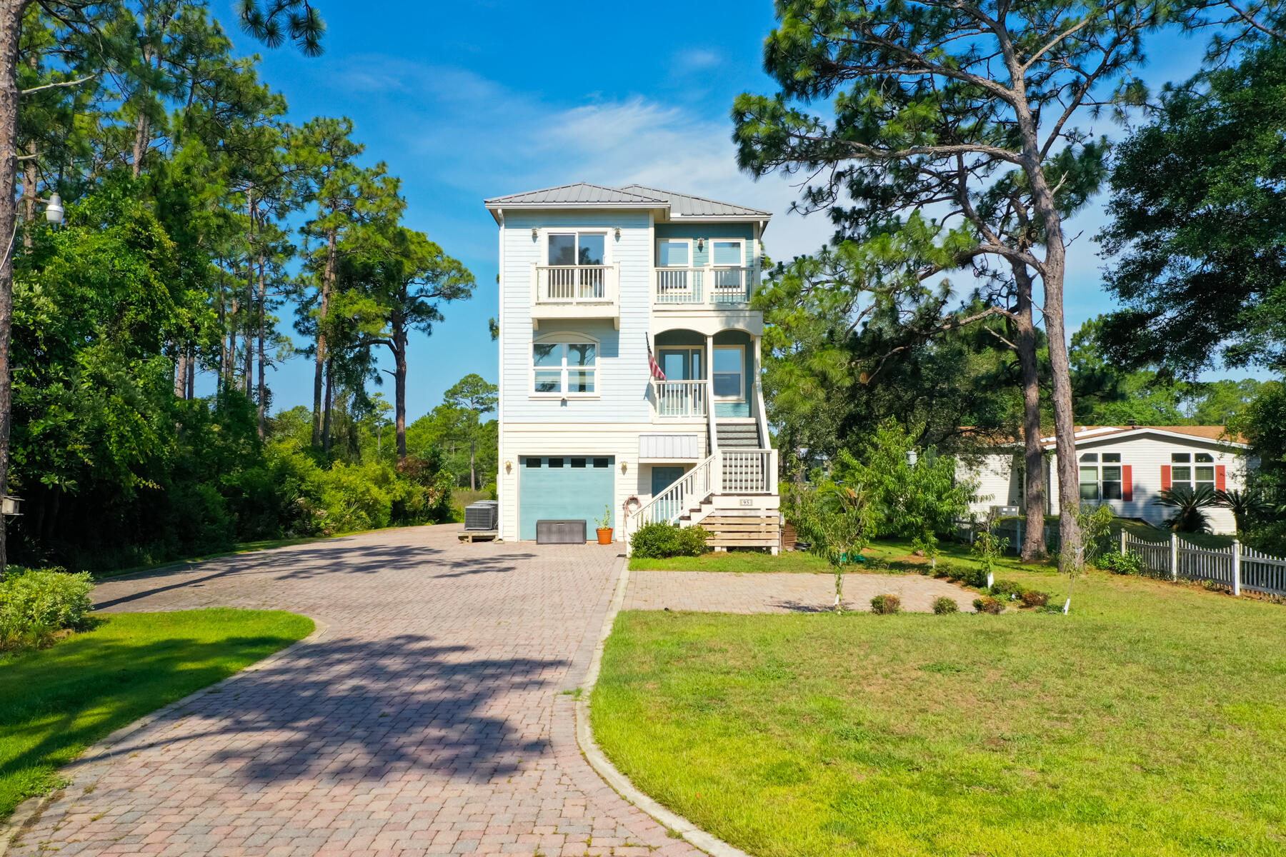 95 Blue Bell Circle Santa Rosa Beach, FL 32459 - Photo 25 of 29 a view of a house with a backyard