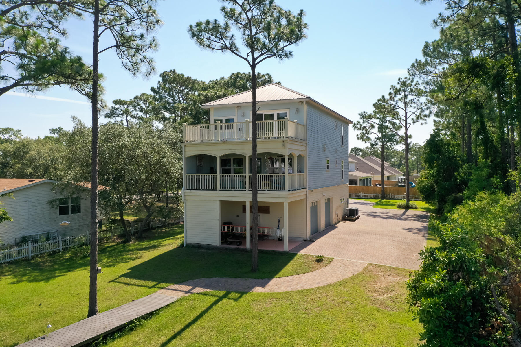 95 Blue Bell Circle Santa Rosa Beach, FL 32459 - Photo 3 of 29 a front view of a house with garden