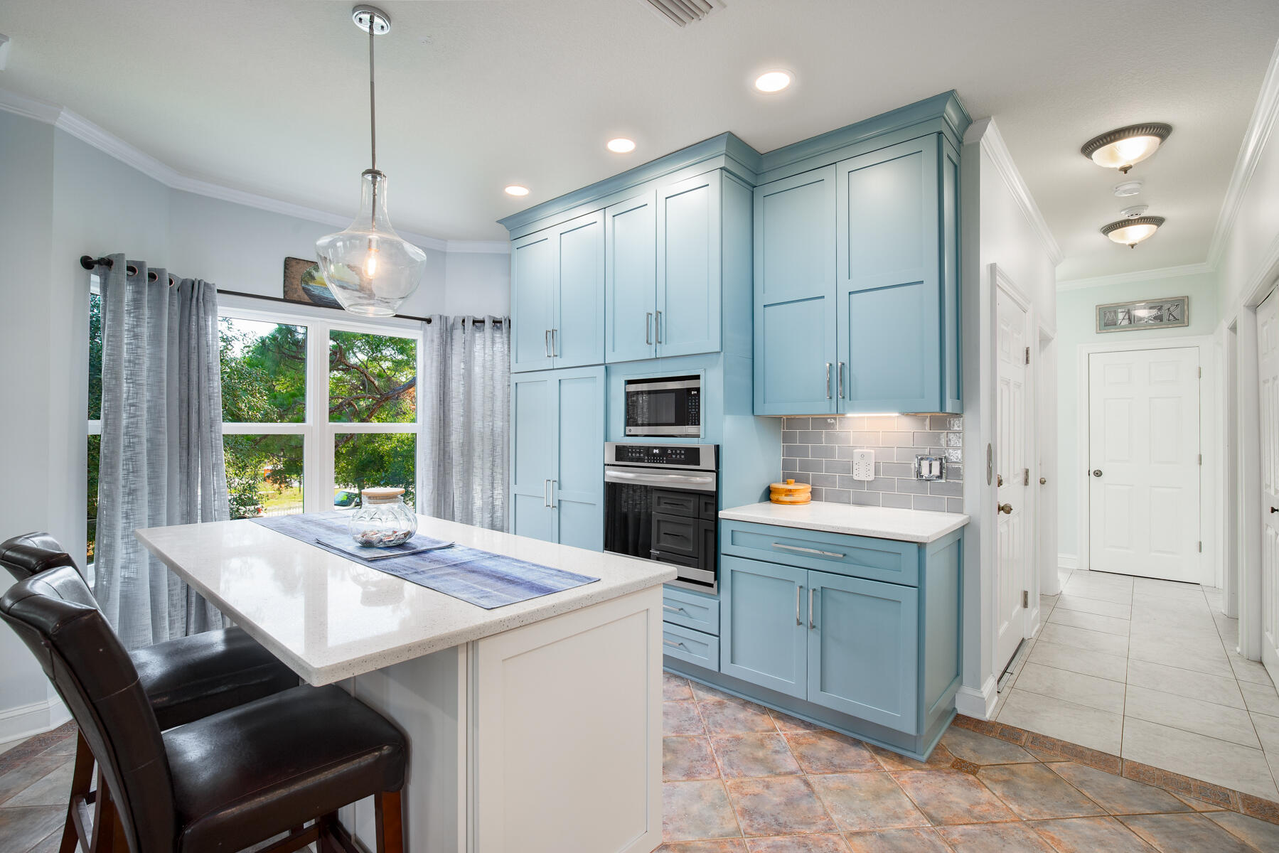 95 Blue Bell Circle Santa Rosa Beach, FL 32459 - Photo 7 of 29 a kitchen with kitchen island a sink stove and refrigerator