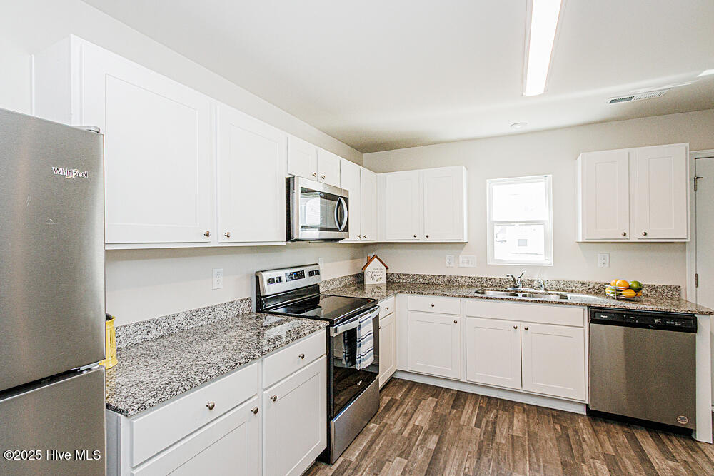 1205 Fescue Road Rocky Mount, NC 27801 - Photo 6 of 17 Lots of cabinet space and stainless appliances!