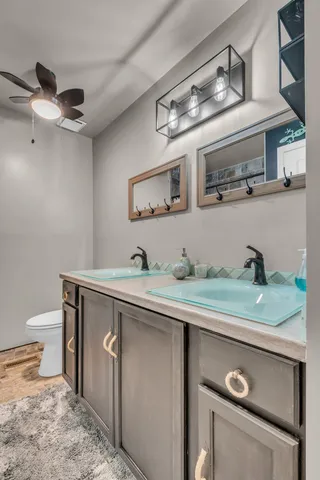 a bathroom with a shower and a sink