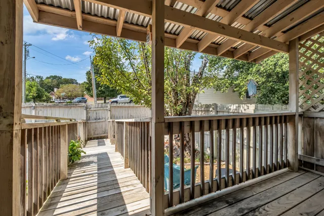a view of a wooden deck with a bench