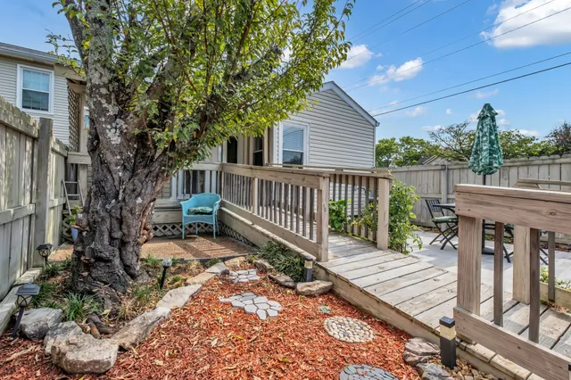 a view of a chairs and table in the patio