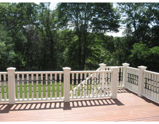40 Rochester Road Newton, MA 02458 - Photo 15 of 21 a view of a wooden deck with a bench