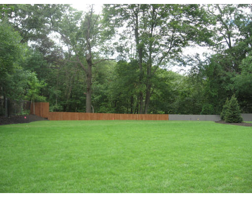 40 Rochester Road Newton, MA 02458 - Photo 19 of 21 a backyard of a house with lots of green space