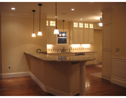 40 Rochester Road Newton, MA 02458 - Photo 4 of 21 a bathroom with a sink a mirror and a light fixture