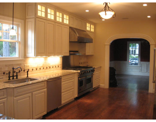 40 Rochester Road Newton, MA 02458 - Photo 9 of 21 a kitchen with stainless steel appliances granite countertop a stove a sink and a microwave