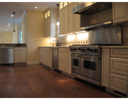40 Rochester Road Newton, MA 02458 - Photo 10 of 21 a kitchen with granite countertop a stove top oven and cabinets