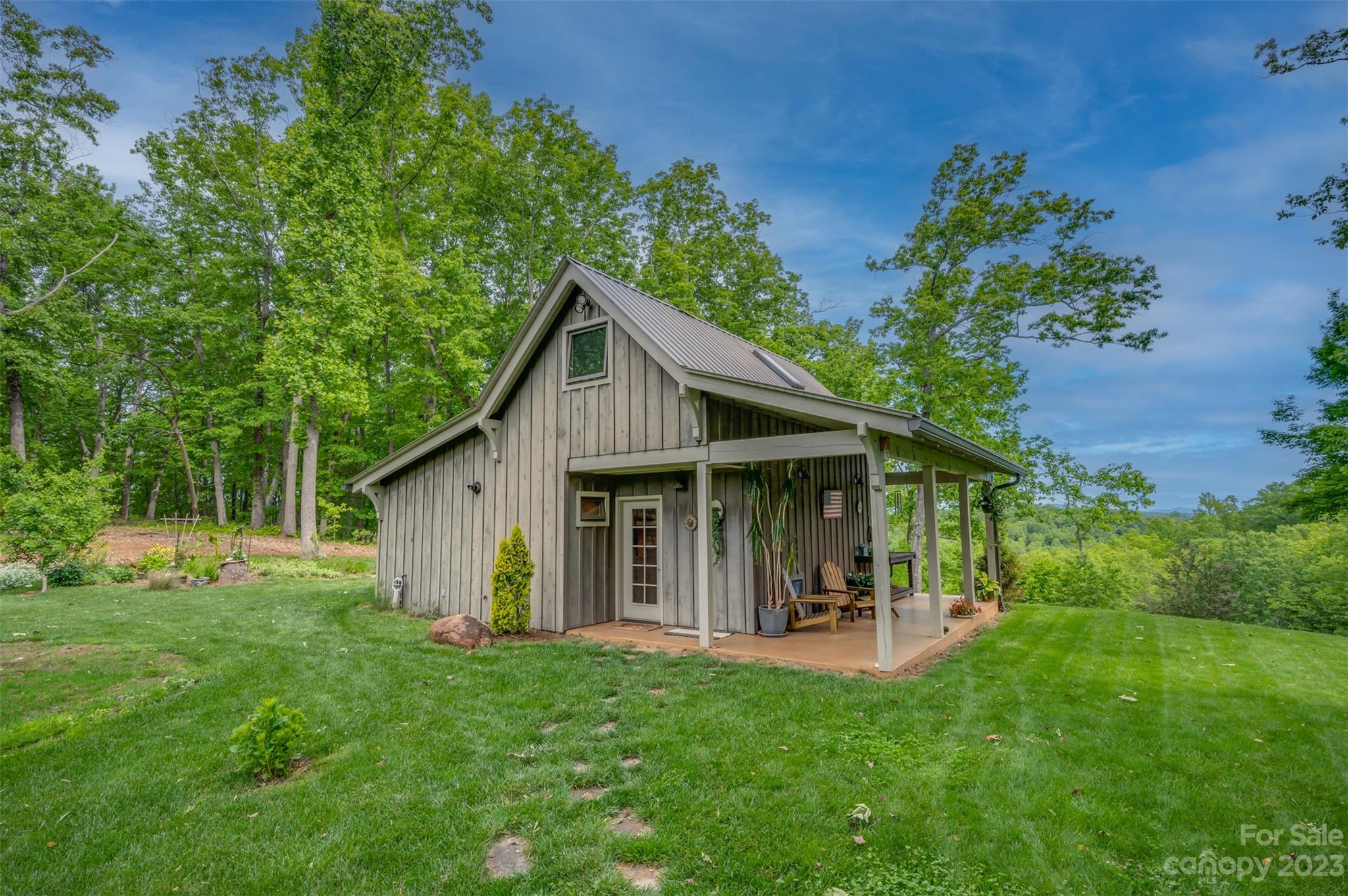 134 Broad River Run Rutherfordton, NC 28139 - Photo 42 of 48 a view of a house with a yard and a garden