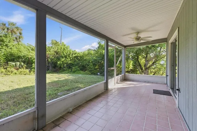 a view of a porch and garden