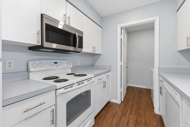 a kitchen with a stove and a microwave