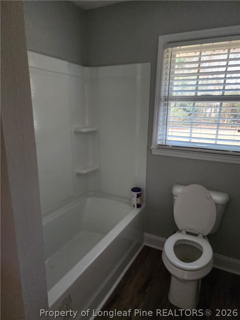 1303 Middle Road Fayetteville, NC 28312 - Photo 13 of 17 a bathroom with a toilet and a bathtub