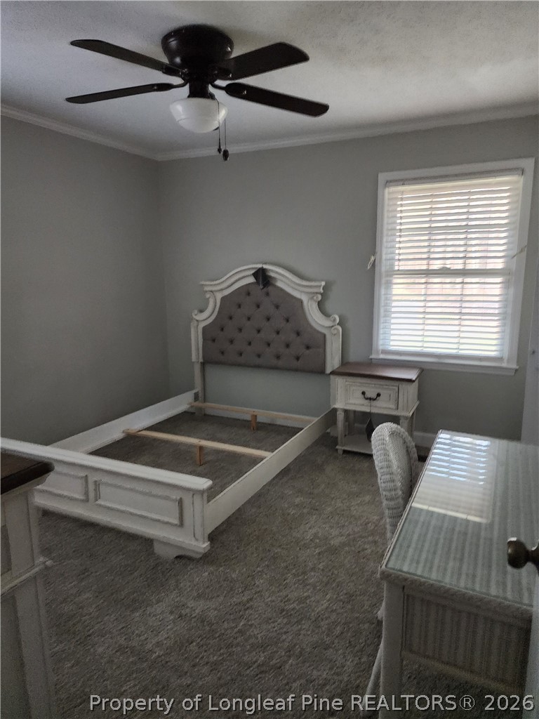 1303 Middle Road Fayetteville, NC 28312 - Photo 17 of 17 a bedroom with a bed and window