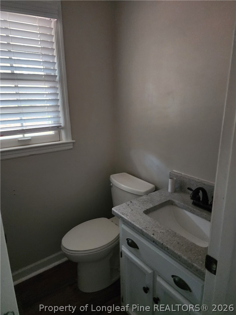 1303 Middle Road Fayetteville, NC 28312 - Photo 7 of 17 a white toilet sitting next to a window