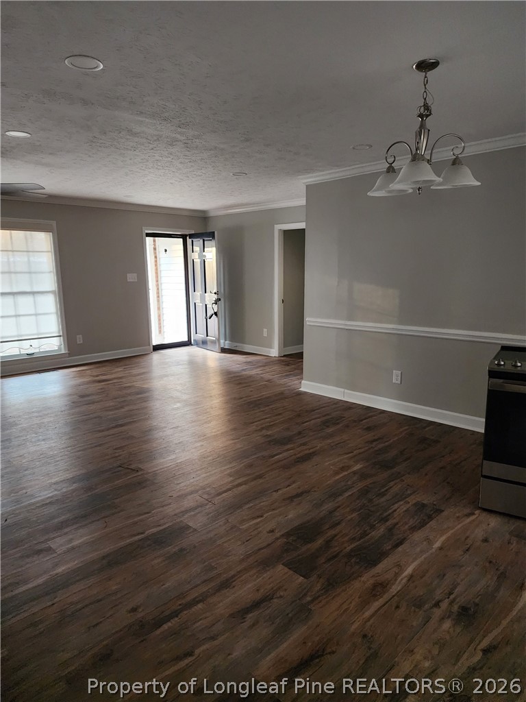 1303 Middle Road Fayetteville, NC 28312 - Photo 10 of 17 an empty room with wooden floor and windows