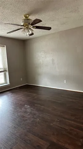 a spacious bathroom with a granite countertop sink mirror and