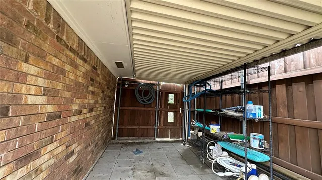 a view of a chairs and table in backyard