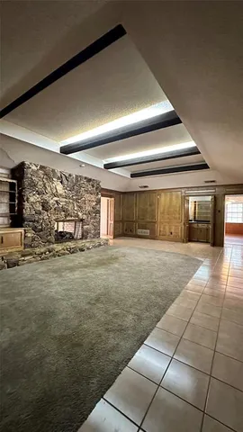 a living room with a open kitchen