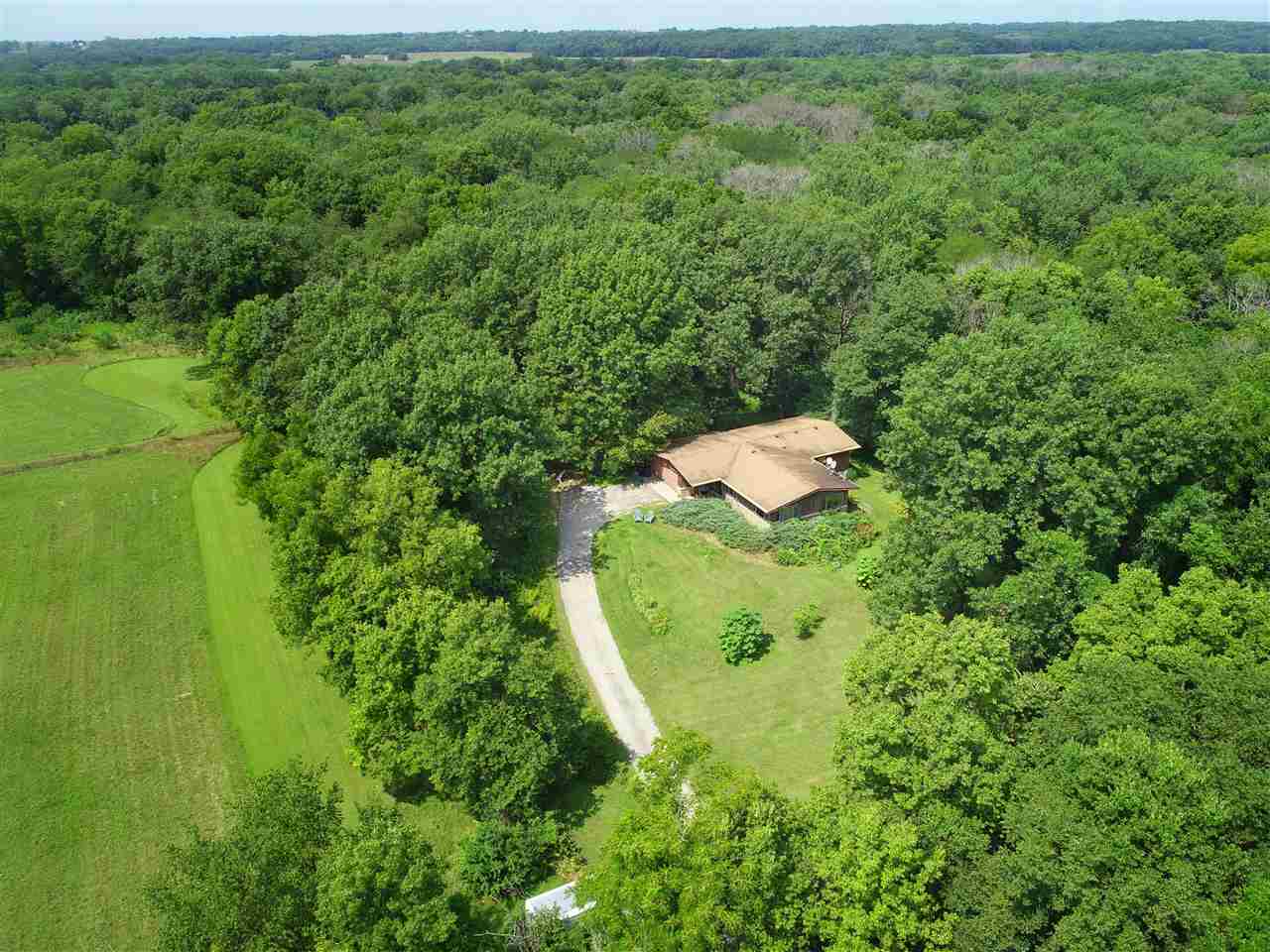 6750 South Lost Nation Road Dixon, IL 61021 - Photo 5 of 7 a view of a yard in a field