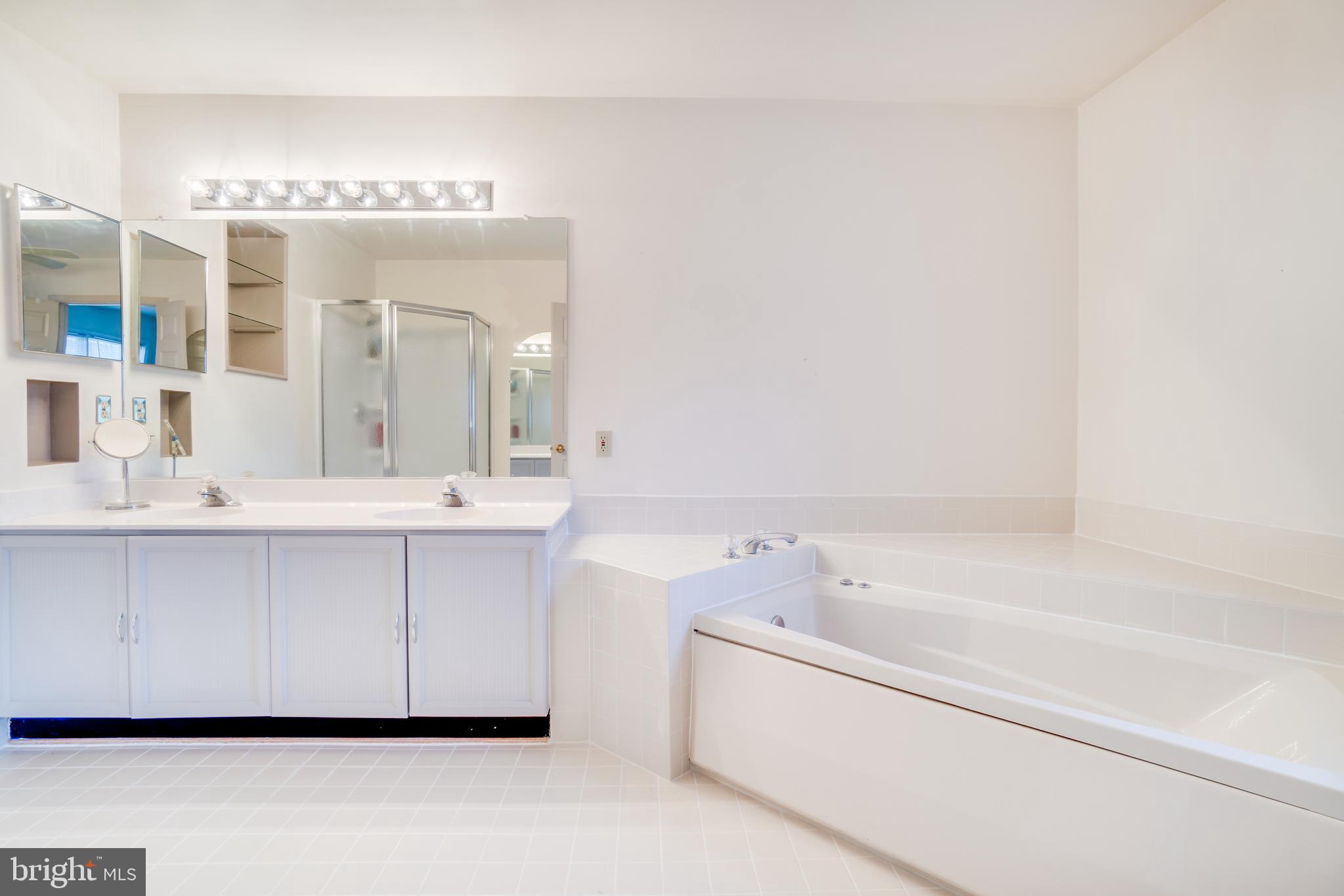 8321 Ridge Crossing Lane Springfield, VA 22152 - Photo 22 of 33 tiled master bath with relaxing soaking tub