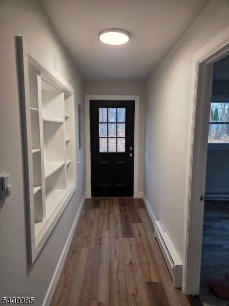441 Rutherford Avenue Franklin, NJ 07416 - Photo 2 of 7 an empty room with wooden floor and a window